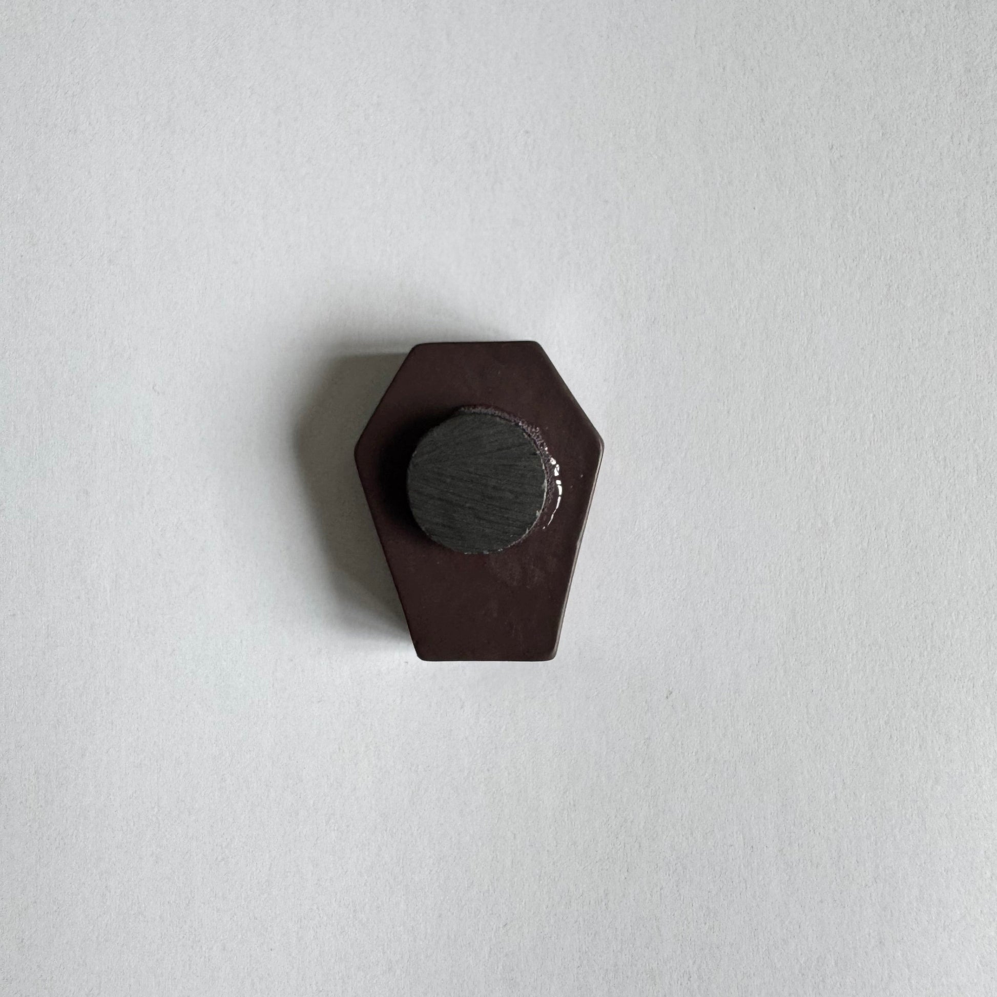 back of a coffin shaped magnet
